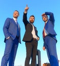 Businessmen with smiling faces in formal suits and ties