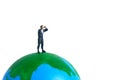 Businessmen standing using binoculars above earth globe. Miniature tiny people toys photography. isolated on white background Royalty Free Stock Photo