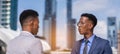 businessmen talk together, building in city and light at background. black man in grey suit and executive man with glasses in blue Royalty Free Stock Photo