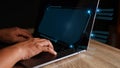 Businessmen use a laptop to view company financial reports and graphics showing financial growth data and figures financial