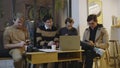 Businessmen using smartphones in cafe. Freelancers having break during meeting Royalty Free Stock Photo