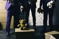 Businessmen wear smart suits and play with soft toys