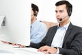 Businessmen wearing microphone headset in call center