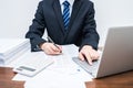 Businessmen who is using computer accounting