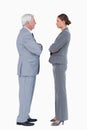 Businesspartner standing face to face with arms folded Royalty Free Stock Photo