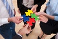 Businesspeople assembling jigsaw puzzle Royalty Free Stock Photo