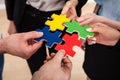 Businesspeople assembling jigsaw puzzle Royalty Free Stock Photo