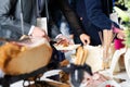 Businesspeople at banquet lunch break at business conference meeting. Assortment of food and drinks. Royalty Free Stock Photo