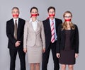 Businesspeople bound by red tape Royalty Free Stock Photo