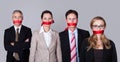 Businesspeople bound by red tape Royalty Free Stock Photo