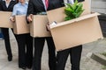 Businesspeople With Cardboard Boxes Royalty Free Stock Photo