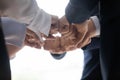 Businesspeople put fists together celebrating successful startup closeup hands Royalty Free Stock Photo