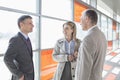 Businesspeople communicating on train platform