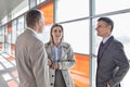 Businesspeople communicating on train platform