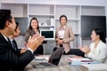 Businesspeople discussing at conference office desk, business team clapping hands to admire compliment during successful Royalty Free Stock Photo