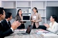 Businesspeople discussing at conference office desk, business team clapping hands to admire compliment during successful Royalty Free Stock Photo