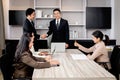 Businesspeople discussing at conference office desk, manager leader shaking hands at group board meeting. businessman reached Royalty Free Stock Photo