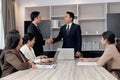 Businesspeople discussing at conference office desk, manager leader shaking hands at group board meeting. businessman reached Royalty Free Stock Photo