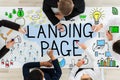 Businesspeople Drawing Landing Page Concept On Table