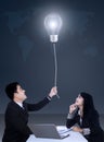 Businesspeople getting a bright idea Royalty Free Stock Photo