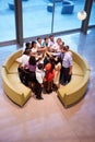 Businesspeople Giving Each Other High Five In Office Lobby Royalty Free Stock Photo