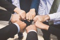 Businesspeople hands in fists in circle, business and teamwork c