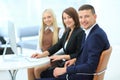 Businesspeople Having Meeting Around Table In Modern Office Royalty Free Stock Photo