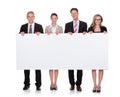 Businesspeople holding a blank banner Royalty Free Stock Photo