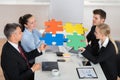 Businesspeople Joining Puzzle Piece Royalty Free Stock Photo