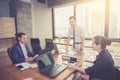 Businesspeople with leader discussing together in conference room during meeting at office. Royalty Free Stock Photo