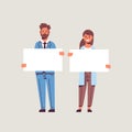 Businesspeople man woman holding empty blank signboard business partners couple showing blank white cardboard