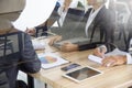 Businesspeople meeting in conferance room with paperwork