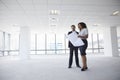 Businesspeople Meeting To Look At Plans In Empty Office Royalty Free Stock Photo