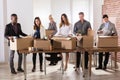 Businesspeople Packing Belongings In Cardboard Box Royalty Free Stock Photo