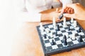 Businesspeople playing chess in office