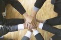 Businesspeople put their hand on top of each other - teamwork, u