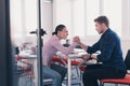 businesspeople, rivalry and people concept - businesswoman and businessman arm wrestling during corporate meeting in Royalty Free Stock Photo