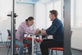 Businesspeople, rivalry and people concept - businesswoman and businessman arm wrestling during corporate meeting in Royalty Free Stock Photo