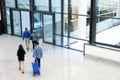 Businesspeople Rushing through Corridor, Motion Blur Royalty Free Stock Photo