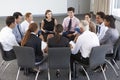 Businesspeople Seated In Circle At Company Seminar Royalty Free Stock Photo