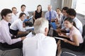 Businesspeople Seated In Circle At Company Seminar Royalty Free Stock Photo