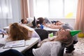 Businesspeople Sleeping In Office