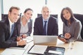 Businesspeople smiling in conference room