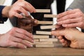 Businesspeople Stacking Wooden Blocks