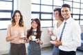 Businesspeople standing together in office Royalty Free Stock Photo