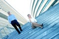 Businesspeople On Steps Of Office Complex