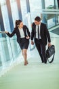 Businesspeople talking as they walk into the office Royalty Free Stock Photo