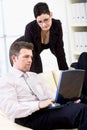 Businesspeople teamworking on laptop Royalty Free Stock Photo