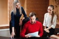 Businesspeople using laptop at conference table Business coach holding training for staff Royalty Free Stock Photo