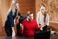 Businesspeople using laptop at conference table, people in office holding a conference and discussing strategies. Royalty Free Stock Photo